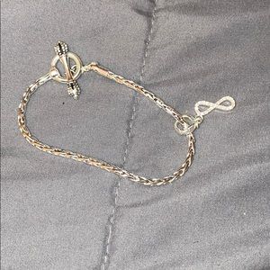 Charm bracelet with infinity charm.
